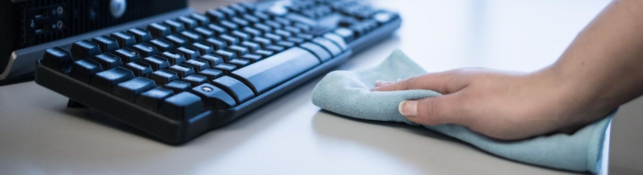 Cleaner cleans with microfibre cloth.