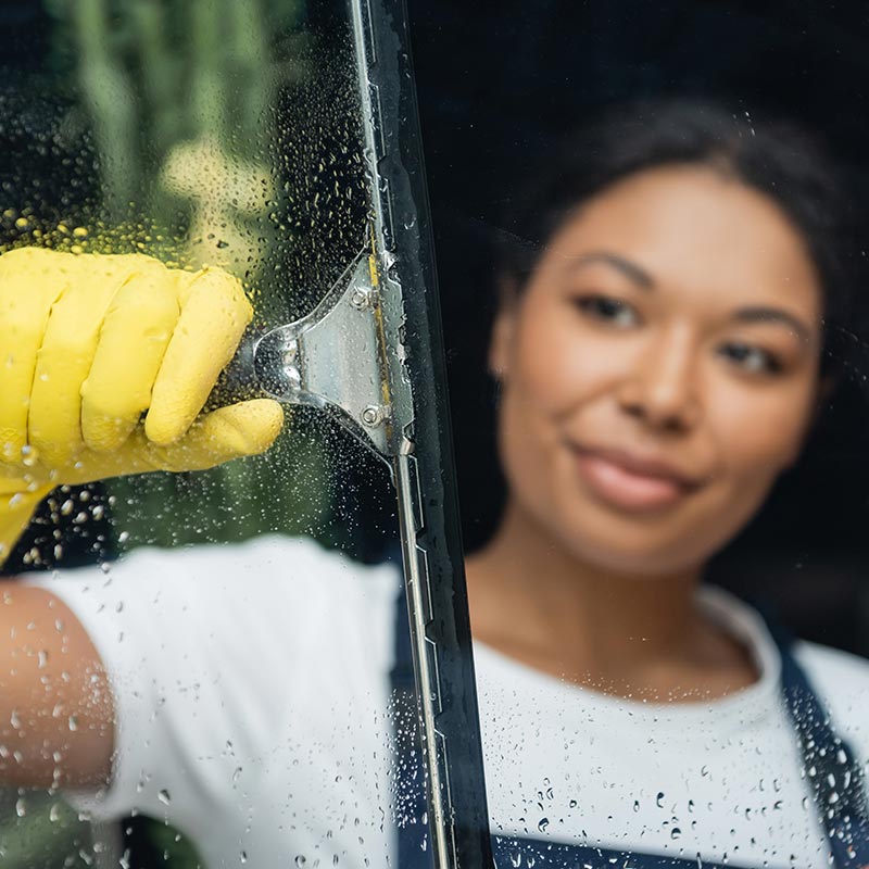 Window washer washes window
