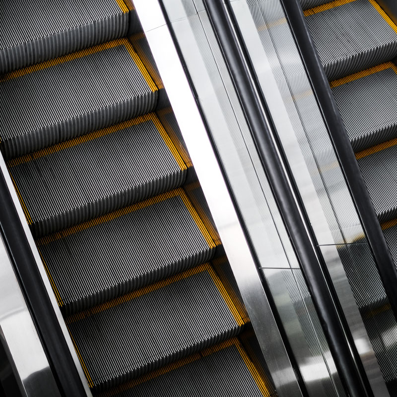 Two escalators next to each other.